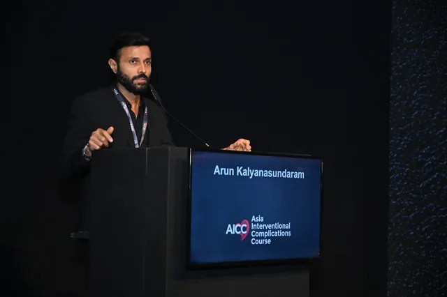 Dr. Arun Kalyanasundaram speaking from the podium